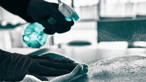 Microfibre cloth cleaning a surface